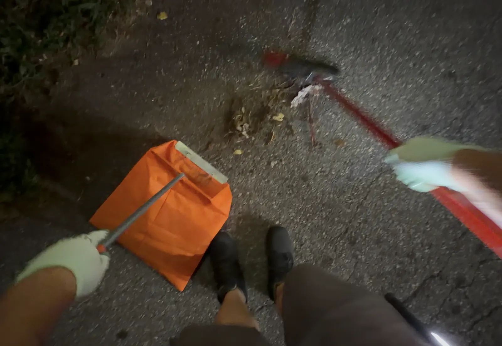 First-person view of NightPort collecting exterior litter into a commercial dustpan